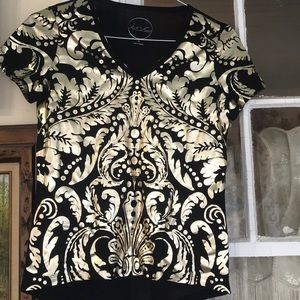 •Gold and black top and never worn